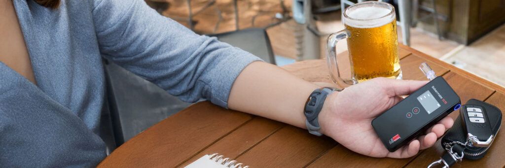 Police-grade fuel cell sensor, Australian & international standards certified, direct blow or fold-out mouthpiece options, Bluetooth app on S5 model, lifetime test counter, and 12-month warranty. Sobermate S2, S3, and S5 devices shown alongside icons.